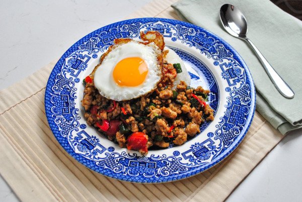 pad krapow gai with fried egg on top