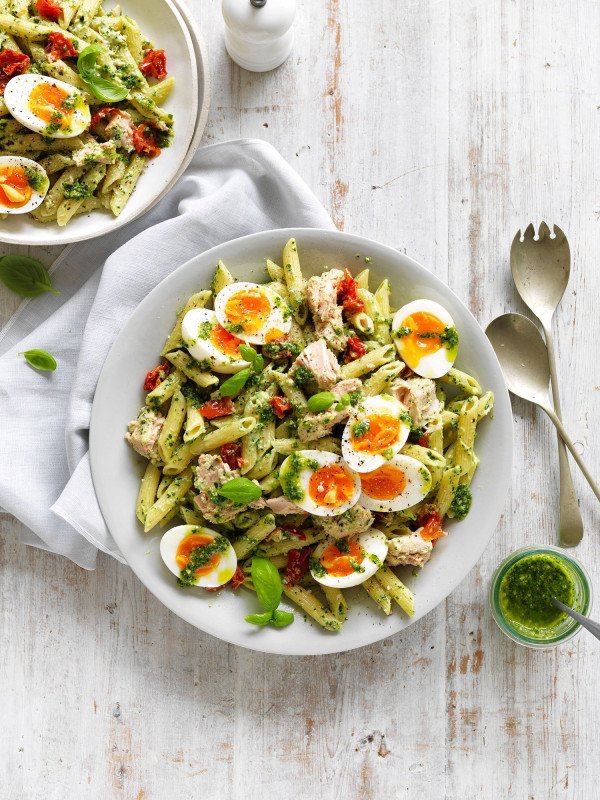 pesto, egg, and tuna pasta salad in a bowl