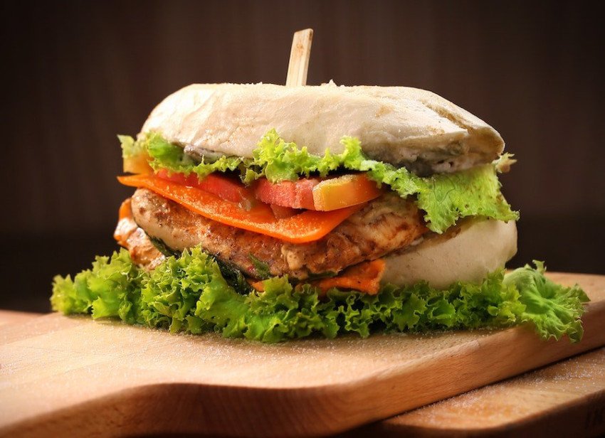 chicken burger on brown chopping board 1624473