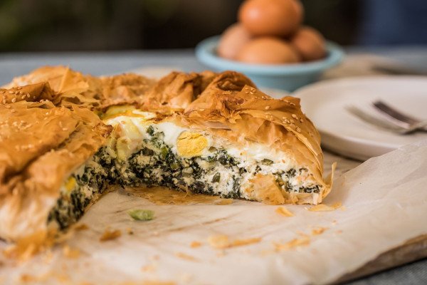 Eggs, Greens, and Cheese Pie cut into from the side