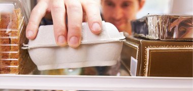 Man getting eggs out of fridge