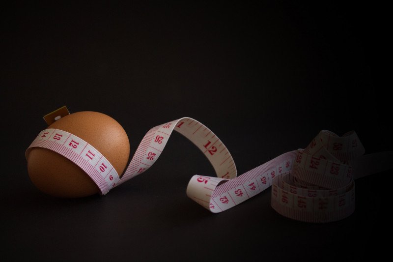 Egg with measure tape